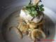 Herb Crusted Cod with Braised Squid, Potato Gnocchi and White Wine Veloute